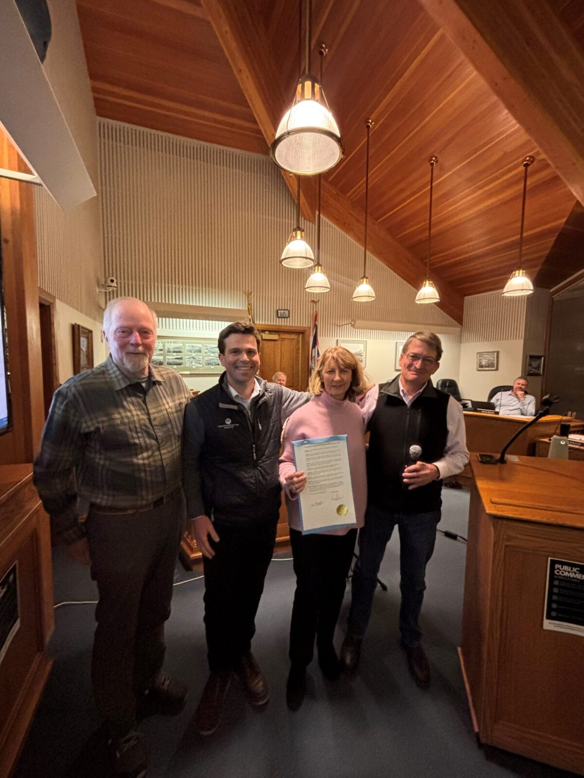 GTF Procl GTNPF Board Member Rob Wallace, GTNPF Vice President of Partnership Projects Ryan Kelly, GTNPF President Leslie Mattson, and Jackson Mayor Arne Jorgenson celebrate the official proclamation honoring the Kelly parcel purchase.