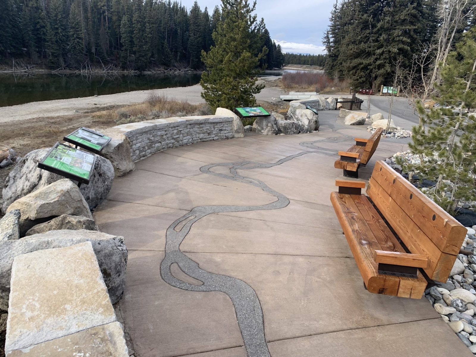 Newly constructed stone walls and wooden benches now welcome users of all types to the overlook at Pacific Creek.