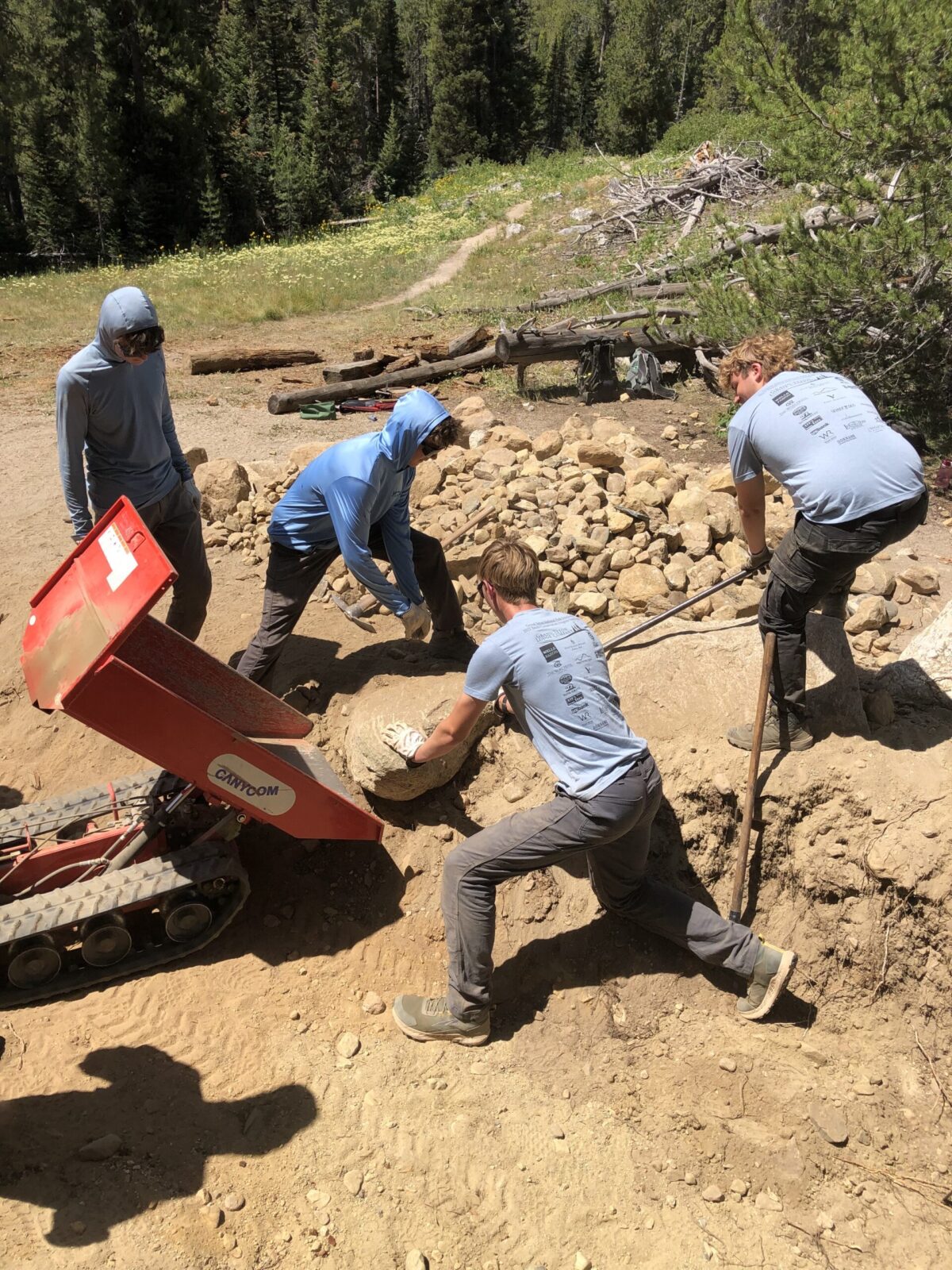 IMG_3741 YCP crew members work together to move large rocks at the Leigh Lake portage.