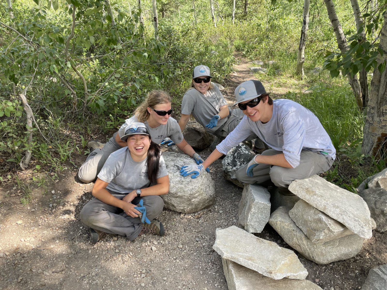 Crew members take a moment to comtemplate moving their new favorite rock.