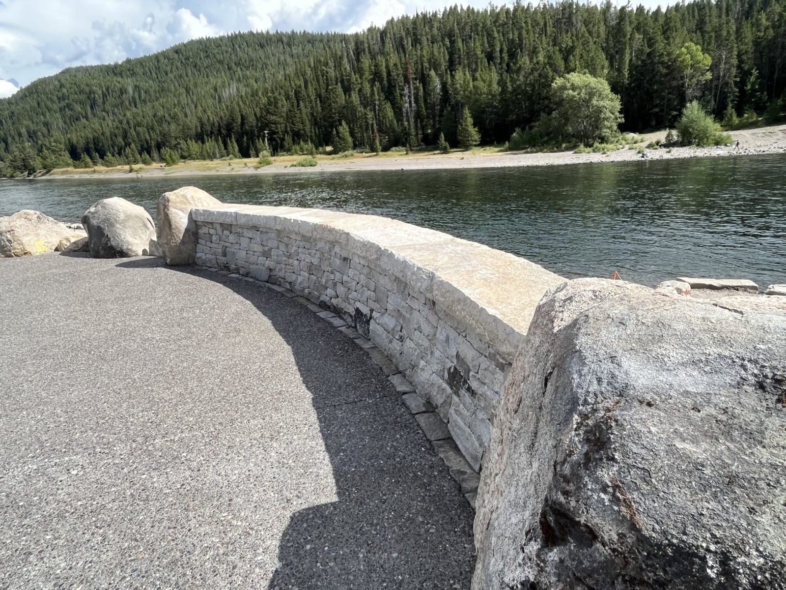 A dry-stack stone wall, similar to those at Pacific Creek and Jenny Lake, was built earlier this summer to create the overlook.