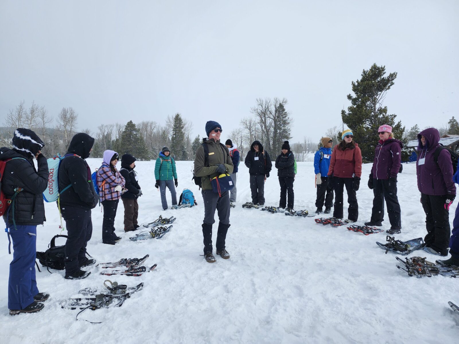 PV Snowshoeing Pura Vida participants gear up to go snowshoeing.