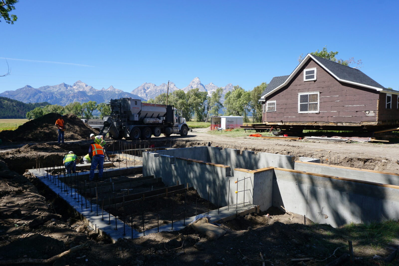 The Roy Chambers cabin temporarily relocated from its original site last summer as contractors worked to construct a new foundation beneath it.