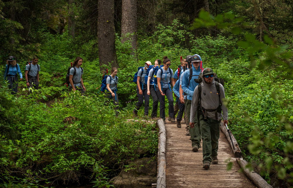 YCP hikes into the job site at Granite Canyon.