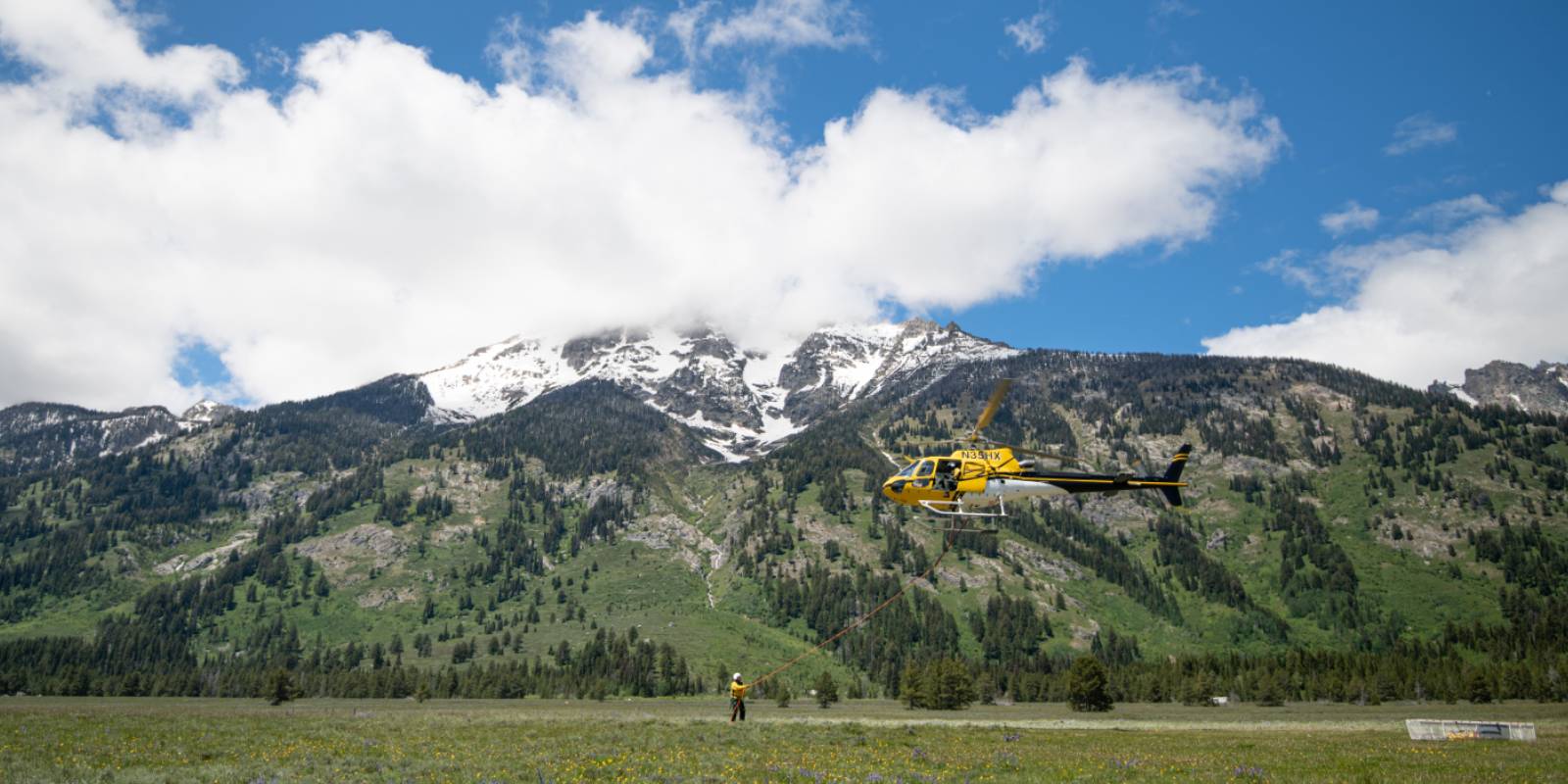 Rescue Helicopter lifting a person - Jenny Lake Rangers